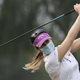 Golfers practicing for a tournament in Beijing wore masks to guard against the air pollution.